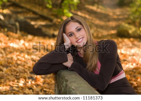 stock photo 13 year old teen girl in fall foliage at Falls Park Pendleton