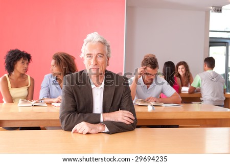 Portrait of University lecturer with students in background