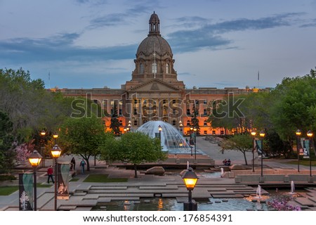 EDMONTON, AB, CANADA - MAY 29: People enjoy a warm evening in front of the Alberta Legislature Building on May 29, 2008 in Edmonton, Alberta Canada. In the foreground are the fountains.