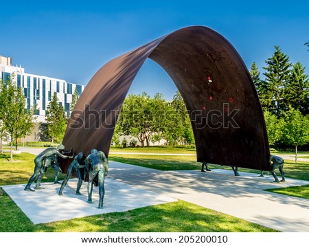 CALGARY, CANADA - JULY 13: Public art at the University of Calgary on July 13, 2014 in Calgary, Alberta Canada. The Taylor Family Digital Library is in the background.