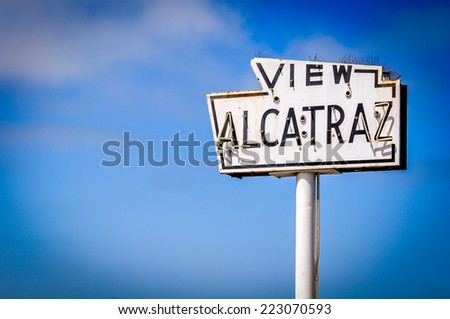 A broken old and abandoned sea-side neon sign that reads View Alcatraz. Located along the waterfront in San Francisco..
