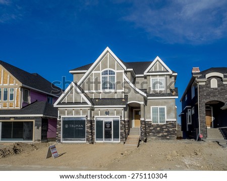 CALGARY, CANADA - APRIL 26: Truman show home under construction in Aspen Woods on April 26, 2015 in Calgary, Alberta. This Truman show home is typical of upscale Calgary suburban communities.