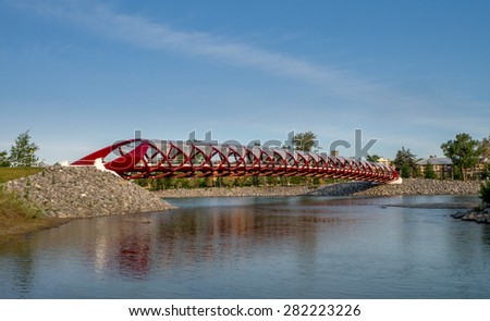 CALGARY, CANADA - MAY 24:  Peace Bridge and Bow River on May 24, 2015 in Calgary, Alberta Canada. The pedestrian bridge spans the Bow River and was designed by Santiago Calatrava