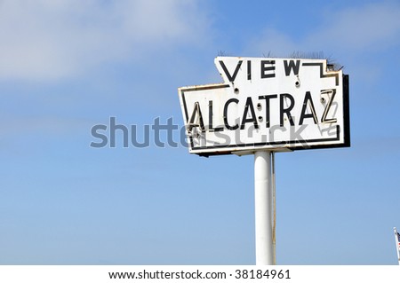 A broken old and abandoned sea-side neon sign that reads View Alcatraz. Located along the waterfront in San Francisco.