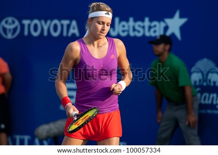 PATTAYA THAILAND - FEBRUARY 11: Maria Kirilenko of Russia reacts after winning a point during semi-final of PTT Pattaya Open 2012 on February 11, 2012 at Dusit Thani Hotel in Pattaya, Thailand