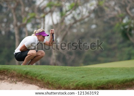 PATTAYA, THAILAND - FEBRUARY 17: Suzann Pettersen of Norway thinks of her next move on day 2 of Honda LPGA Thailand 2012 on February 17, 2012 at Siam Country Club Old Course in Pattaya, Thailand