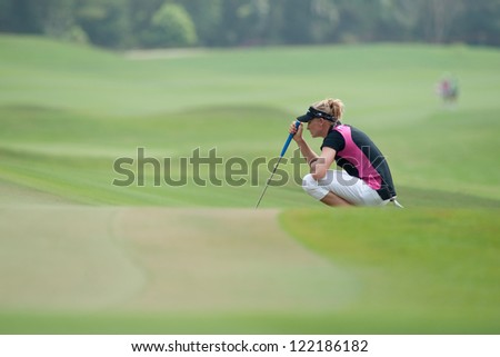 PATTAYA THAILAND - FEBRUARY 17: Ryann O\'Toole of USA thinks of her next move during Day 2 of Honda LPGA Thailand 2012 on February 17, 2012 at Siam Country Club Old Course in Pattaya, Thailand