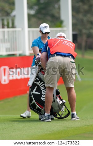 PATTAYA THAILAND - FEBRUARY 17: Morgan Pressel of USA puts away golf clubs during Day 2 of Honda LPGA Thailand 2012 on February 17, 2012 at Siam Country Club Old Course in Pattaya, Thailand