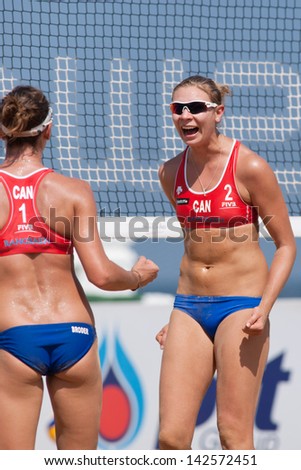 CHONBURI, THAILAND-OCTOBER 25: Kristina Valias (R) of Canada reacts after winning a point during Day 2 of Bangsaen Thailand Open on October 25, 2012 at Bangsaen Beach in Chonburi, Thailand