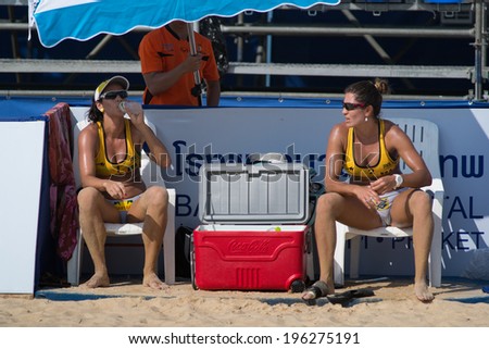 PHUKET, THAILAND-OCTOBER 31: Agatha Bednarczuk (L) of Brazil and partner during a break on Day 2 of Phuket Open on OCTOBER 31, 2013 at Karon Beach in Phuket, Thailand