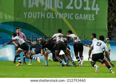 NANJING, CHINA-AUGUST 18: Fiji Rugby Team (white) plays against Argentina Rugby Team (blue) during Day 2 match of 2014 Youth Olympic Games on August 18, 2014 in Nanjing, China. France won 34-12.