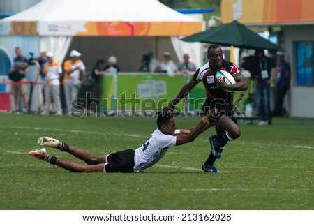 NANJING CHINA-AUGUST 20 Fiji Rugby Team white plays against Kenya Rugby Team black during bronze medal match of 2014 Youth Olympic Games on August 20 2014 in Nanjing China Fiji wins 12-0 NANJING CHINA-AUGUST 20 Fiji Rugby Team white plays against Kenya Rugby Team black during bronze medal match of 2014 Youth Olympic Games on August 20 2014 in Nanjing China Fiji wins 12-0