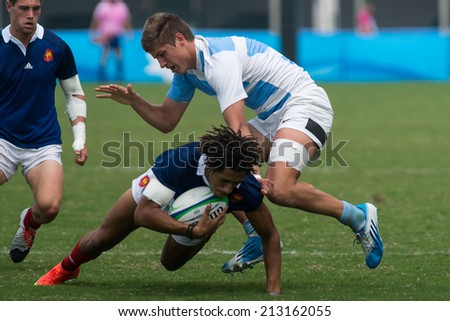 NANJING, CHINA-AUGUST 20: Argentina Rugby Team (white) plays against France Rugby Team (blue) during final match of 2014 Youth Olympic Games on August 20, 2014 in Nanjing, China. France wins 45-22