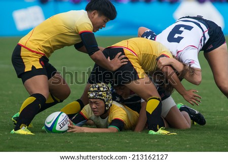 NANJING, CHINA-AUGUST 20: China Team (yellow) plays against USA Team (white/blue) during bronze medal match of 2014 Youth Olympic Games on August 20, 2014 in Nanjing, China. China wins 12-0.