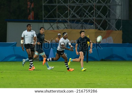 NANJING, CHINA-AUGUST 18: Fiji Rugby Team (white) plays against Argentina Rugby Team (blue) during Day 2 match of 2014 Youth Olympic Games on August 18, 2014 in Nanjing, China.