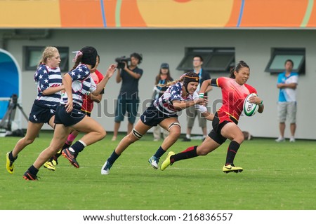 NANJING, CHINA-AUGUST 18: USA Rugby Team (white/blue) plays against China Rugby Team (red) during Day 2 match of 2014 Youth Olympic Games on August 18, 2014 in Nanjing, China.