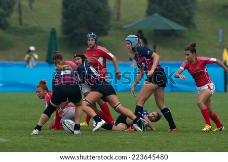 NANJING, CHINA-AUGUST 19: USA Rugby Team (blue) plays against Tunisia Rugby Team (red) during Day 3 match of 2014 Youth Olympic Games on August 19, 2014 in Nanjing, China. USA wins 26-0.