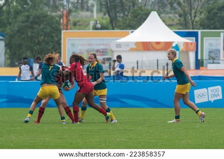 NANJING, CHINA-AUGUST 19: Australia Rugby Team (green) plays against Canada Rugby Team (red) during Day 3 match of 2014 Youth Olympic Games on August 19, 2014 in Nanjing, China. Australia wins 21-5.