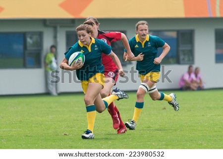 NANJING, CHINA-AUGUST 19: Australia Rugby Team (green) plays against Canada Rugby Team (red) during Day 3 match of 2014 Youth Olympic Games on August 19, 2014 in Nanjing, China. Australia wins 21-5.