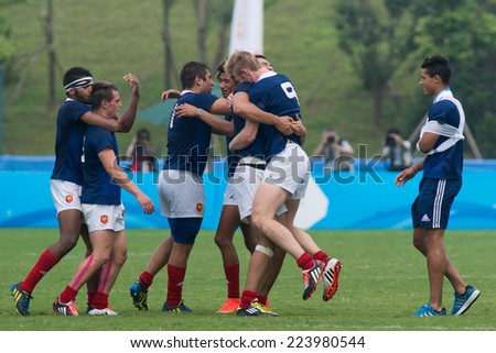 NANJING, CHINA-AUGUST 20: France rugby team celebrates their victory after winning the gold medal match of 2014 Youth Olympic Games on August 20, 2014 in Nanjing, China.
