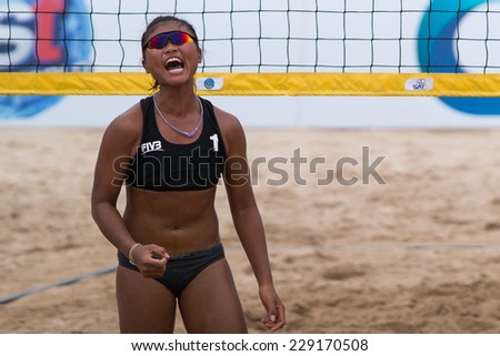 PATTAYA, THAILAND-NOVEMBER 5: Saowaros Tangkaeo of Thailand reacts after winning a point during Qualification of Pattaya Thailand Challenger on November 5, 2014 at Pattaya Beach in Pattaya, Thailand