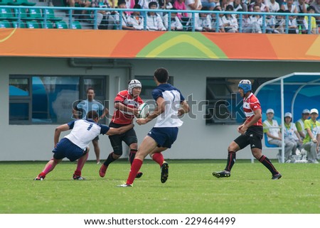 NANJING, CHINA-AUGUST 19: French Rugby Team (white) plays against Japan Rugby Team (red) on Day 3 match of 2014 Youth Olympic Games on August 19, 2014 in Nanjing, China. France wins 28-7.