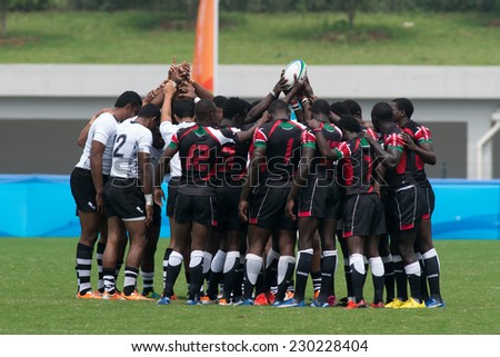 NANJING, CHINA-AUGUST 19: Kenya Rugby Team (black) and Fiji Rugby Team chant together before a match during Day 3 of 2014 Youth Olympic Games on August 19, 2014 in Nanjing, China.