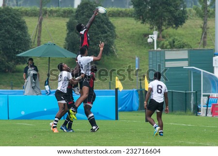 NANJING, CHINA-AUGUST 19: Fiji Rugby Team (white) plays against Kenya Rugby Team (black) during Day 3 match of 2014 Youth Olympic Games on August 19, 2014 in Nanjing, China. Kenya wins 17-12.