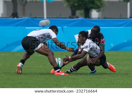 NANJING, CHINA-AUGUST 19: Fiji Rugby Team (white) plays against Kenya Rugby Team (black) during Day 3 match of 2014 Youth Olympic Games on August 19, 2014 in Nanjing, China. Kenya wins 17-12.