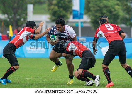 NANJING, CHINA-AUGUST 19: USA Rugby Team (white) plays against Japan Rugby Team (red) during Day 3 match of 2014 Youth Olympic Games on August 19, 2014 in Nanjing, China. USA wins 29-12.