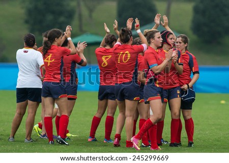 NANJING, CHINA-AUGUST 19: Spain Rugby Team (red-blue) celebrates a win over Tunisia Rugby Team during Day 3 match of 2014 Youth Olympic Games on August 19, 2014 in Nanjing, China.