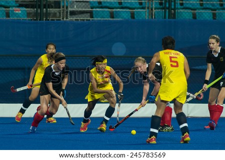 NANJING, CHINA-AUGUST 21: Germany Hockey Team (black) plays against China Hockey Team (Yellow) during Day 5 match of 2014 Youth Olympic Games on August 21, 2014 in Nanjing, China.