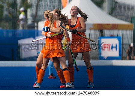 NANJING, CHINA-AUGUST 20: Holland Hockey Team (orange) celebrates a goal during Day 4 match of 2014 Youth Olympic Games on August 20, 2014 in Nanjing, China.