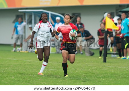 NANJING, CHINA-AUGUST 19: Canada Rugby Team (white) plays against China Rugby Team (red) during semifinals match of 2014 Youth Olympic Games on August 19, 2014 in Nanjing, China.