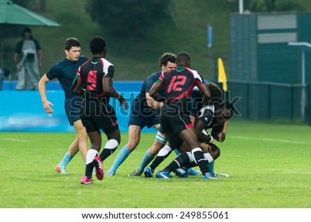 NANJING, CHINA-AUGUST 19: Argentina Rugby Team (blue) plays against Kenya Rugby Team (black-red) during semifinals match of 2014 Youth Olympic Games on August 19, 2014 in Nanjing, China.