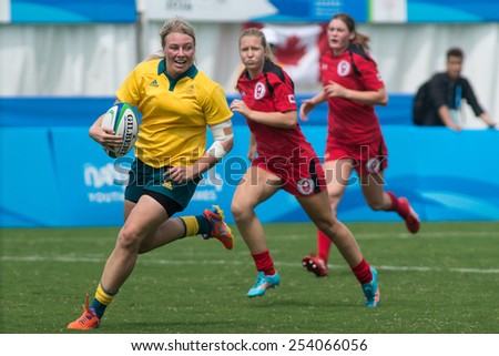 NANJING, CHINA-AUGUST 20: Australia Rugby Team (yellow) plays against Canada Rugby Team (red) during final match of 2014 Youth Olympic Games on August 20, 2014 in Nanjing, China. Australia wins 38-10.