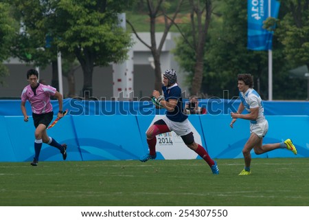 NANJING, CHINA-AUGUST 20: Argentina Rugby Team (white-blue) plays against France Rugby Team (blue) during final game of 2014 Youth Olympic Games on August 20, 2014 in Nanjing, China. France wins 45-22