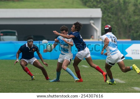 NANJING, CHINA-AUGUST 20: Argentina Rugby Team (white-blue) plays against France Rugby Team (blue) during final game of 2014 Youth Olympic Games on August 20, 2014 in Nanjing, China. France wins 45-22