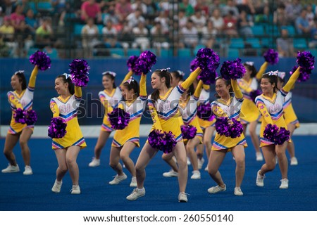 NANJING, CHINA-AUGUST 20: 2014 Summer Youth Olympic Games cheerleaders perform during break at Day 4 Hockey5\'s match of 2014 Youth Olympic Games on August 20, 2014 in Nanjing, China.