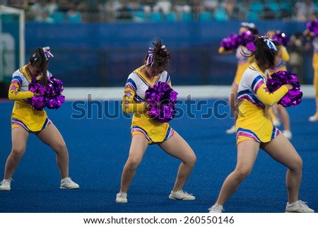 NANJING, CHINA-AUGUST 20: 2014 Summer Youth Olympic Games cheerleaders perform during break at Day 4 Hockey5\'s match of 2014 Youth Olympic Games on August 20, 2014 in Nanjing, China.
