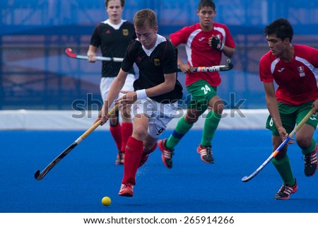NANJING, CHINA-AUGUST 21: Germany Hockey Team (black) plays against Mexico Hockey Team (red) during Day 5 match of 2014 Youth Olympic Games on August 21, 2014 in Nanjing, China.