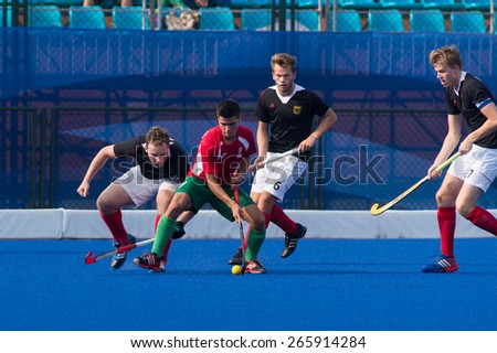 NANJING, CHINA-AUGUST 21: Mexico Hockey Team (red) plays against Germany Hockey Team (black) during Day 5 match of 2014 Youth Olympic Games on August 21, 2014 in Nanjing, China.