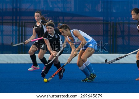 NANJING, CHINA-AUGUST 21: New Zealand Hockey Team (black) plays against Uruguay Hockey Team (blue) on Day 5 match of 2014 Youth Olympic Games on August 21, 2014 in Nanjing, China. Uruguay wins 6-3.
