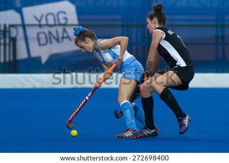 NANJING, CHINA-AUGUST 21: New Zealand Hockey Team (black) plays against Uruguay Hockey Team (blue) on Day 5 match of 2014 Youth Olympic Games on August 21, 2014 in Nanjing, China. Uruguay wins 6-3.