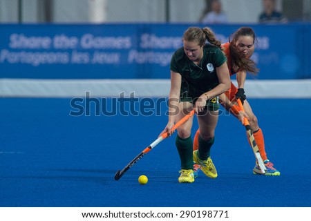 NANJING, CHINA-AUGUST 21: Netherlands Hockey Team (orange) plays against South Africa Hockey Team (green) on Day 5 match of 2014 Youth Olympic Games on August 21, 2014 in Nanjing, China.