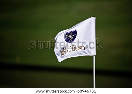 HUA HIN, THAILAND - JANUARY 7: The Royal Trophy golf flag pole on the 8th hole of The Royal Trophy tournament, Europe VS Asia on January 9, 2011 at Black Mountain Golf Club in Hua Hin, Thailand