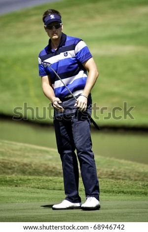 HUA HIN, THAILAND - JANUARY 9: Swedish golfer Henrik Stenson in action during final day of The Royal Trophy tournament, Europe VS Asia on January 9, 2011 at Black Mountain Golf Club in Hua Hin, Thailand