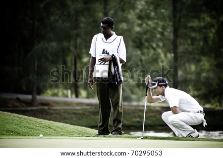 HUA HIN THAILAND - DECEMBER 16: An unidentified golfer thinks of his next move during Day 1 of Black Mountain Masters 2010 on December 16, 2010 at Black Mountain Golf Club in Hua Hin Thailand