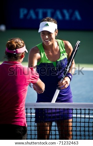 PATTAYA THAILAND - FEBRUARY 8: Serbian tennis player Ana Ivanovic shakes hand with the opponent after winning the first round match of PTT Pattaya Open at Dusit Thani Hotel in Pattaya, Thailand