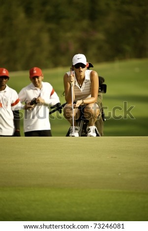 PATTAYA THAILAND - FEBRUARY 19: American player Michelle Wie thinks of her next move during Day 3 of Honda LPGA Thailand 2011 on February 19, 2011 at Siam Country Club Old Course in Pattaya, Thailand
